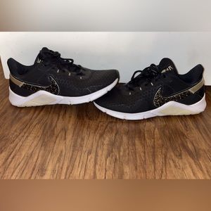 Black and gold Nikes